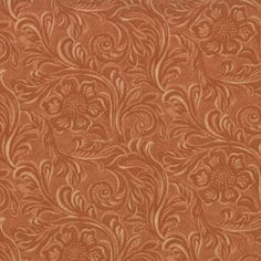 an orange background with swirls and flowers on the outside, in shades of brown