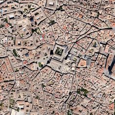 an aerial view of a city with lots of buildings