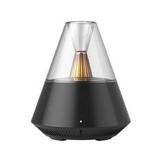 an image of a black and white light on top of a glass cone shaped object