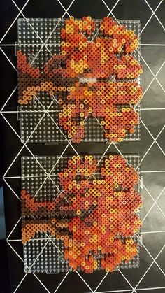 two pieces of art made out of orange beads