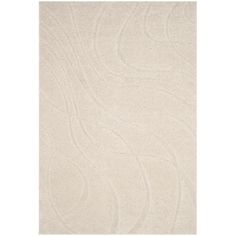 a white rug with wavy lines on it