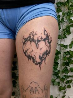 a person with a tattoo on their thigh