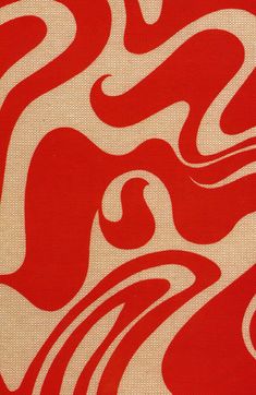 a red and white abstract design on fabric