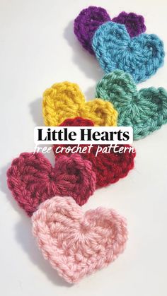 four crocheted hearts with the words little hearts written on them