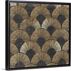 a gold and black art deco wall hanging on a white wall with an intricate fan design