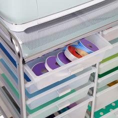 the drawers are filled with different colored tape