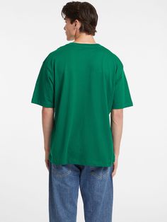 An oversized tee featuring our classic embroidered logo. Crafted in our organic cotton blend. Classic Green Top With Embroidered Logo, Casual Green T-shirt With Embroidered Logo, Relaxed Fit Green Top With Embroidered Logo, Green Relaxed Fit Top With Embroidered Logo, Casual Green Tops With Embroidered Logo, Green Cotton Top With Embroidered Logo, Green Cotton Tops With Embroidered Logo, Casual T-shirt With Embroidered Logo, Green Classic Relaxed Fit T-shirt