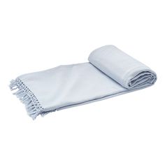 two towels folded on top of each other with fringes around the edges and one rolled up