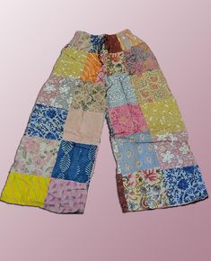 Introducing our Wevez Patchwork Pants, perfect for any casual occasion. These pants come in a beautiful pink and blue pattern and are made of high-quality cotton fabric with a drawstring closure and elastic waist for a relaxed fit. The wide-leg style and patchwork accents give these pants a unique hippie boho vibe, making them a great addition to any wardrobe. These one-size-fits-all pants are suitable for women of all sizes and are perfect for yoga, urban outings, or just lounging at home. The palazzo style adds to the comfortability of the pants while the cotton material provides breathability and durability. Get your hands on these stylish pants from the trusted brand Wevez today! Patchwork Pants, Palazzo Style, Pants Boho, Boho Yoga, Festival Pants, Stylish Pants, Hippie Festival, Boho Vibe, Blue Pattern