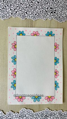 a paper with flowers and polka dots on the border is displayed in front of an empty piece of paper