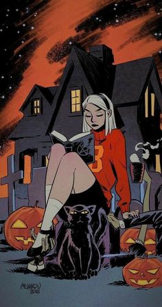 a woman sitting on top of a black cat in front of a house with pumpkins