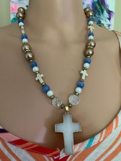 Introducing our stunning Beaded Necklace with a White Cross Pendant - the perfect addition to any jewelry collection. This cross necklace is a beautiful symbol of faith and a must-have for any religious jewelry lover. The white cross pendant adds an elegant touch to this religious necklace, making it perfect for special occasions such as weddings, baptisms, and church events. Our faith necklace is not only a stylish accessory but also a meaningful religious symbol that will be cherished for year Beaded Cross Pendant Jewelry Gift, Beaded Cross Pendant Jewelry For Gift, Spiritual Beaded Cross Pendant Necklace, Spiritual Beaded Cross Pendant Jewelry, Spiritual Cross Necklaces For Jewelry Making, Beaded Cross Pendant For Jewelry Making, White Spiritual Cross Pendant Jewelry, White Spiritual Crucifix Necklace, White Crucifix Spiritual Necklace