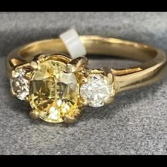 This Ring Is Preowned And Is Size 6.5 Gia Certified Classic Yellow Rings, Classic Yellow Gia Certified Rings, Classic Oval Yellow Sapphire Ring, Classic Yellow Sapphire Ring With Diamonds, Classic Yellow Sapphire Oval Rings, Classic Yellow Ring With Center Stone, Classic Yellow Rings With Center Stone, Classic Yellow Sapphire Ring With Prong Setting, Classic Yellow Sapphire Diamond Ring