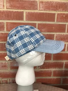 Hand made blue and white checked baseball cap with plain blue brim and plain cream lining- bespoke and unique. This bespoke and unique baseball cap is part of the Drunken at range by KAL. Each individual cap is hand made, uses recycled plastic bottles for the brim and has a contrasting lining. It is adjustable to accommodate all sizes and has an eyelet in the main body of the hat. 'Drunken Hats' specialises in unique bespoke hand made products. Each item is individual and has the 'Drunken Hats' Casual Gingham Hats With Curved Brim, Blue Brimmed Cotton Baseball Cap, Blue Cotton Brimmed Baseball Cap, Blue One Size Flat Cap Baseball Cap, Adjustable Plaid Cap, Blue Adjustable Flat Cap, Adjustable Blue Flat Cap, Classic Blue Six-panel Dad Hat, Blue Six-panel Cotton Fitted Hat