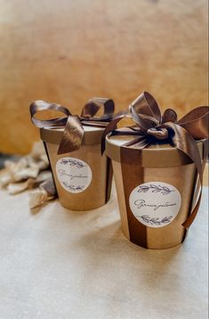 three wrapped gift boxes sitting on top of a table