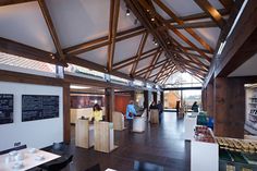 the inside of a restaurant with people eating and drinking