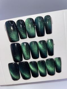 Green and black cat eye press on nail set!  These are suitable for a size medium in nail sizes and are long square  Please reference photo of size chart to ensure this suit will suit/fit you. All nails come ready to wear and will include mini nail filer, mini buffer, nail glue and sticky nail tabs (you can use those instead of glue if you want).  They will also include 6 extra nails  For any questions at all please message me. No returns/refunds. Please read shop policies. Cat Eye Nails Square, Light Green Cat Eye Nails, Forest Green Cat Eye Nails, Black And Green Cat Eye Nails, Green Glass Nails, Green Mirror Nails, Chrome Dark Green Nails, Dark Green Glitter Nails, Green Cat Eye