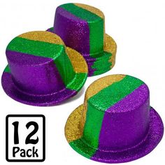 two purple and green hats with gold trims on each one's side, next to the number 12 pack