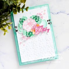 a close up of a card with flowers on it and the words happy birthday written in pink