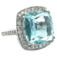 Our cushion ring will undoubtedly captivate your heart with its stunning aquamarine gemstone that glimmers with every movement. The centerpiece of this magnificent ring features a remarkable 15.50-carat aquamarine that is elegantly surrounded by 1.65 carats of dazzling round white diamonds. It makes this ring with 17.15 total carat weight. This ring is crafted from 18K white gold, adding a touch of luxury and sophistication to this impressive piece. With a finger size 7, this fashionable ring is Diamond Ring Set, Rings Fashion, Aquamarine Jewelry, Diamond Ring Settings, Bling Rings, Fabulous Jewelry, I Love Jewelry, Fine Rings, Gorgeous Jewelry