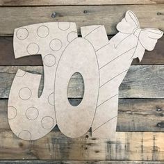 a wooden sign with the word joy on it