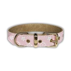 a pink leather dog collar with white flowers on the front and gold metal hardwares