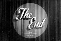 black and white photograph of the end logo on curtained background with text overlay