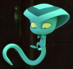 a green toy with yellow eyes and a hat on it's head, hanging from a hook