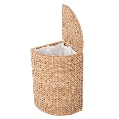 a round wicker basket with a lid for tissue and other items to use in the bathroom