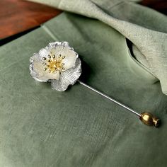 Introducing our exquisite Silver Poppy Flower Brooch Pin, a timeless accessory that effortlessly blends elegance with nature-inspired beauty. This handcrafted brooch is a celebration of delicate craftsmanship and the grace of the poppy flower, making it a perfect addition to your jewelry collection or a thoughtful gift for a loved one. Crafted from high-quality sterling silver, the brooch features a meticulously detailed poppy flower design that captures the essence of nature in every petal. The Elegant Flower Lapel Pin For Anniversary, Elegant Flower Shaped Lapel Pin For Anniversary, Elegant Flower Shaped Anniversary Lapel Pin, Silver Flower Lapel Pin, Silver Flower Shaped Lapel Pin Brooch, Silver Flower Lapel Pin Gift, Silver Flower Lapel Pin For Gift, Broches Jewelry, Poppy Jewelry