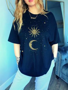 Live by the Sun, Love by the Moon, Sun and Moon Shirt, Celestial Tee, Baggy shirt, Indie aesthetic, Aesthetic clothing, 90s style t shirt ➼ ➼ Please be aware that there may be shipping delays due to the pandemic. Thank you so much for understanding. Sizes & Fit * Unisex tee, classic fit * Fit may be slightly oversized on women, for a very oversized look, go one size up. * Please refer to size chart in photos to determine best size * Let me know if you have any questions! Materials * 100% sof Oversized Star Print Summer Tops, Grunge Style Star Print T-shirt For Summer, Summer Grunge Star Print Top, Celestial Moon Print Crew Neck T-shirt, Trendy Relaxed Fit Top With Moon Print, Bohemian Short Sleeve T-shirt With Sun And Moon Design, Relaxed Fit Graphic Tee With Moon Print, Relaxed Fit Moon Print Graphic Tee, Oversized Crew Neck Top For Festival