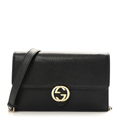 This is an authentic GUCCI Dollar Calfskin Interlocking G Chain Wallet in Black. This stylish clutch wallet is crafted of textured calfskin leather in black and features a front flap with a polished light gold interlocking G Gucci logo and an optional crossbody gold chain shoulder strap with a leather shoulder pad. The flap opens to a compact black leather and fabric interior with card slots and a zipper compartment. Gucci Logo, Chain Wallet, Wallet Chain, Clutch Wallet, Shoulder Pads, Gold Chain, Gold Chains, Card Slots, Calf Skin