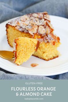 a piece of orange cake on a white plate