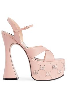 Light pink platform sandals from Gucci. Made of leather, this model sits on a cream leather sole and features an adjustable buckle strap at the ankle and silver-tone monogram hardware.Buckle fasteningPlatform soleSculptural spool heel and a 6cm platform 100% LeatherLining: Calf LeatherSole: Calf LeatherMade in Italy Pink Platform Sandals, Gucci Pink, Gucci Heels, Gucci Shop, Pink Platforms, Color Crema, Spool Heel, Leather Platform Sandals, Sneaker Jewelry