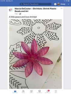 an image of a pink flower on top of a piece of paper with the words, march