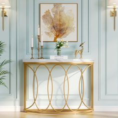 an elegant console table with gold accents in a blue room