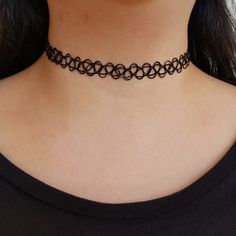 🖊️ Product details 🖊️ Trendy black tattoo choker. The tattoo choker can be stretched to fit any size.  Two-piece tattoo set: 1 x Bracelet  1 x Choker Three-piece tattoo set: 1 x Black Choker Necklace  1 x Bracelet  1 x Ring Colours available: 1. Clear 2. Y2K Pink 3. Doja Pink 4. Baby Blue  5. Cerulean 6. Teal 7. Ruby Red 8. Lime Green 9. Amethyst 10. Rose 11. Tangerine 12. Neon lemon 13. Cinnamon 14. Rainbow Road 15. Banana 16. Leaf Green Karen's neck is 35cm. Mojo models sample necklaces only, he is not involved in the handling of your jewellery for hygiene purposes! 🐾 Check out our charm tattoo chokers! https://www.etsy.com/au/listing/1076947865/black-tattoo-choker-necklace-with-charm?ref=shop_home_active_25   💛 Thank you for choosing our store, we hope you love your goodies as much Cheap Punk Festival Choker, Grunge Black Choker For Festival, Adjustable Black Grunge Jewelry, Trendy Adjustable Black Choker, Black Grunge Choker Jewelry, Trendy Black Adjustable Choker, Trendy Black Festival Choker, Minimalist Black Jewelry For Festivals, Wire Tattoo