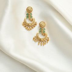 Description: Step into elegance with our antique chandbali earrings, featuring delicate green kempu stones set in vintage antique gold plating. With timeless charm and exceptional craftsmanship, these earrings are perfect for adding a sophisticated touch to any outfit. Details & Specifications: Materials used: Brass Alloy with Antique Gold Platting Weight - 11.75 gm Length - 4 cm Make it custom: Want to make it a custom Earrings? Sure! Reach out to us at support@tarinika.com and we’ll be happy t Green Chandbali Bridal Earrings With Latkans, Green Chandbali Chandelier Earrings For Diwali, Elegant Green Chandbalis With Latkans, Diwali Green Chandbali Chandelier Earrings, Festive Green Chandbali Chandelier Earrings, Green Chandbali Danglers Temple Jewelry, Green Chandbali Danglers In Temple Jewelry Style, Green Chandbali Temple Chandelier Earrings, Ornate Brass Chandbali Danglers