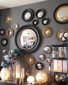 there are many different mirrors on the wall