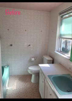 a bathroom with a sink, toilet and bathtub next to a window in it