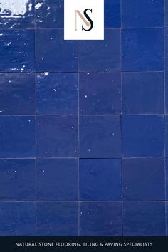 a blue tile wall with the letter s on it and an ad for natural stone flooring, tiling & paving specialtys