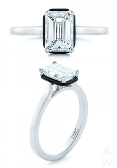 an emerald - cut diamond ring with black accents sits on top of the white background