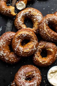 doughnuts and dip on a black surface