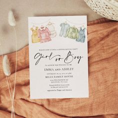 a card with clothes hanging on a line and the words girl or boy next to it