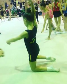 several young children are practicing their moves in an indoor dance class at the school's gym