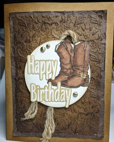 a happy birthday card with cowboy boots on it