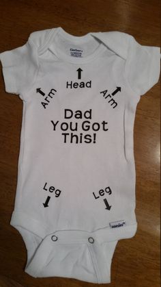 a baby bodysuit with arrows pointing to the words dad you got this on it