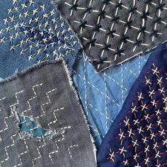 several pieces of fabric with stitchs and crosses on them, all in different colors