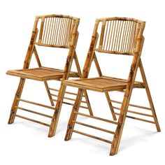 two bamboo folding chairs sitting next to each other