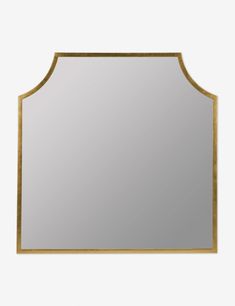 a gold framed mirror on a white wall with a black border around the edges and bottom edge